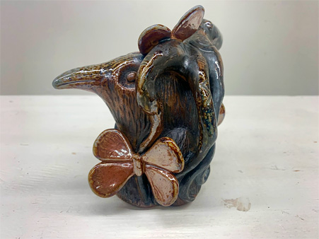 bird with octopus and butterflies soda fired